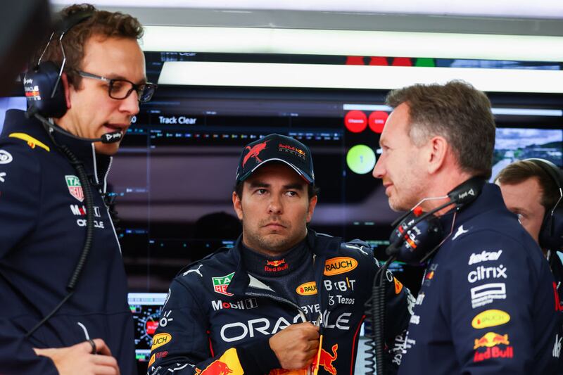 Christian Horner y Checo Pérez