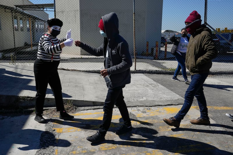 Unaccompanied Guatemalan children who were deported from Mexico deplane at La Aurora International Airport, in Guatemala City, Tuesday, Feb. 7, 2023. The children were stopped in the border between Mexico and United States. (AP Photo/Moises Castillo)