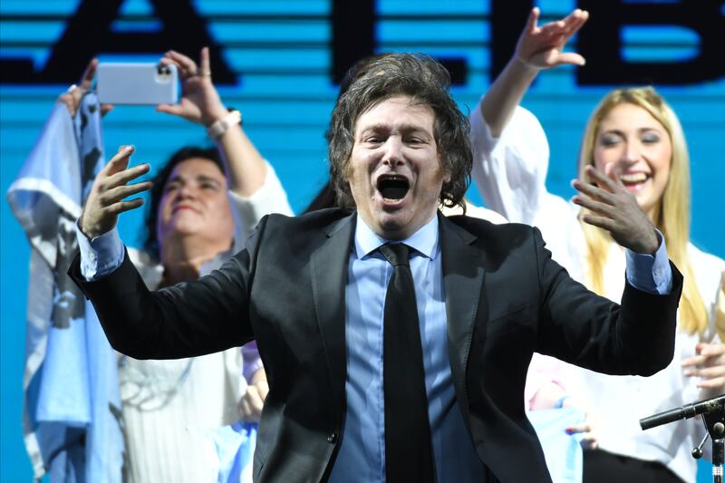 BUENOS AIRES, ARGENTINA - NOVEMBER 14: Candidate Javier Milei of La Libertad Avanza party celebrates with his supporters after the legislative midterm elections at La Libertad Avanza bunker on November 14, 2021 in Buenos Aires, Argentina. Milei of La Libertad Avanza party gained 17,04% of the votes with 98,71% of the voting counted and will be National Deputie for Buenos Aires City. Argentina renews half of the Chamber of Deputies and a third of the Senate in eight districts. (Photo by Amilcar Orfali/Getty Images)